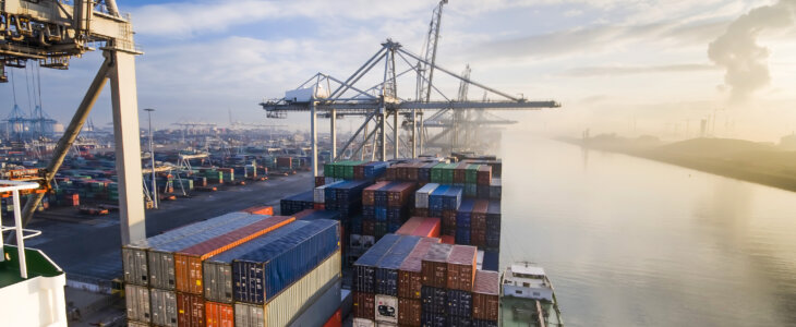 Cargo ship with containers at a sea port