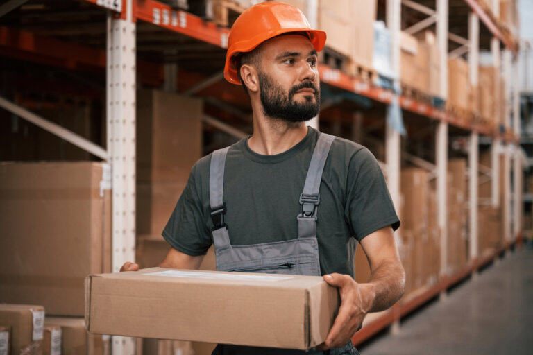 Warehouse worker carrying a box